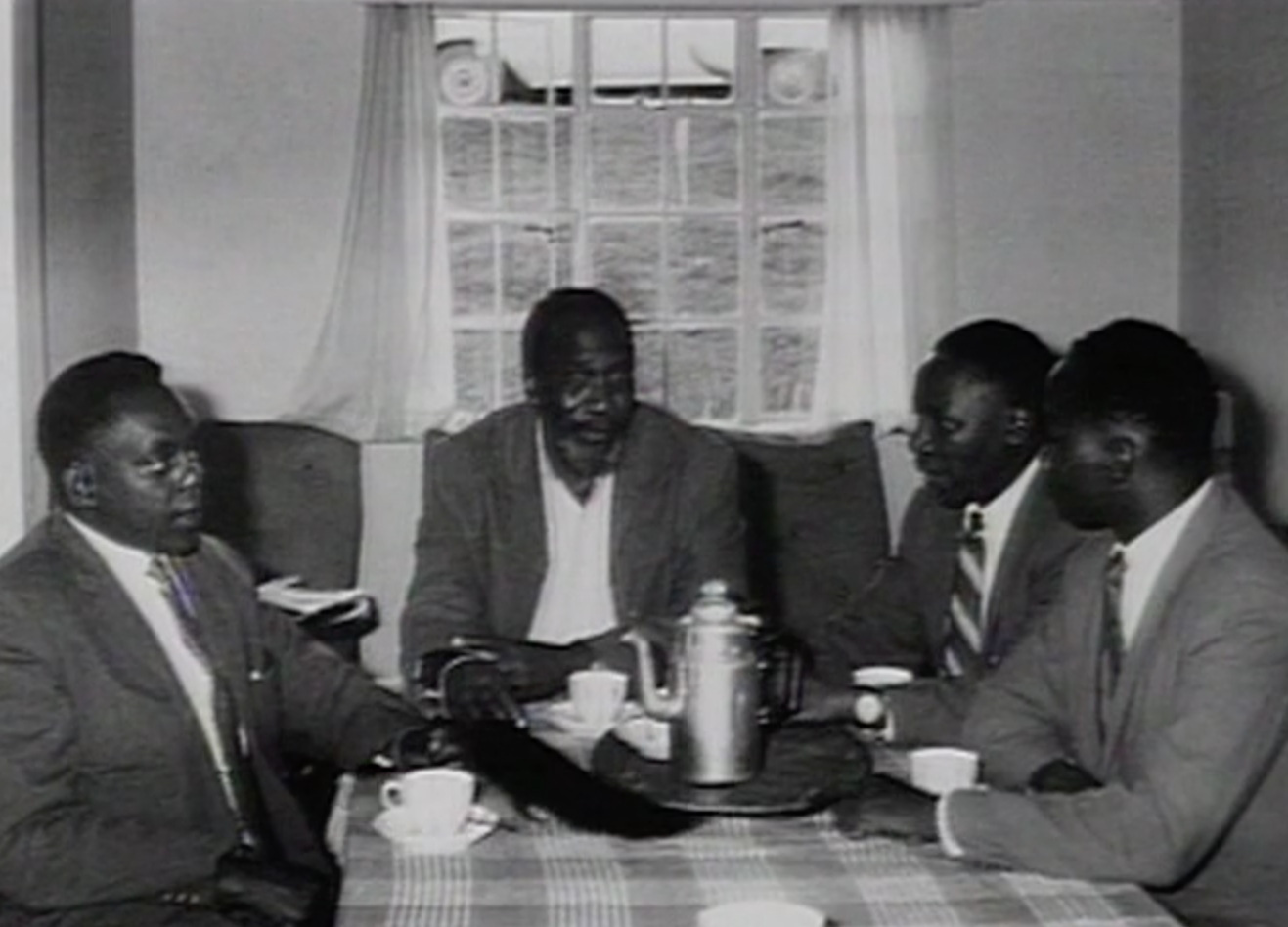 Stanley Kinga (left) meeting Jomo Kenyatta (centre)