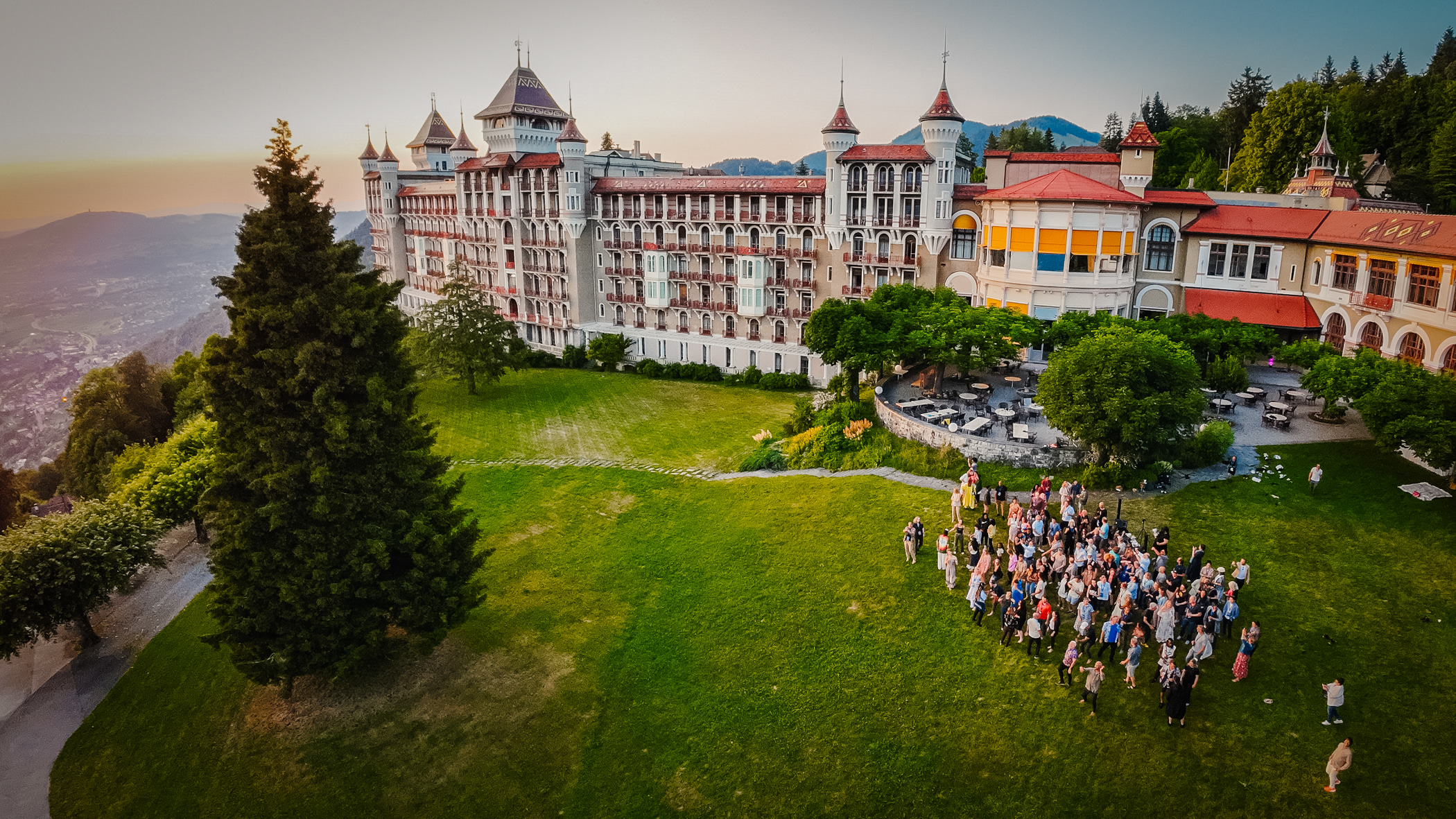 Caux Palace HATCH people in garden drone 2023 