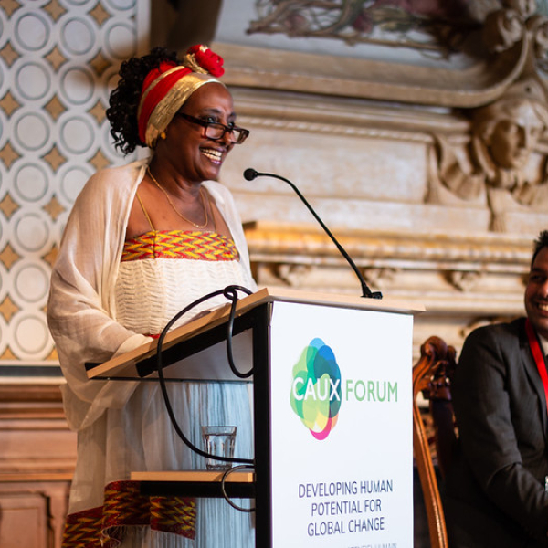 Woman speaking Caux Forum
